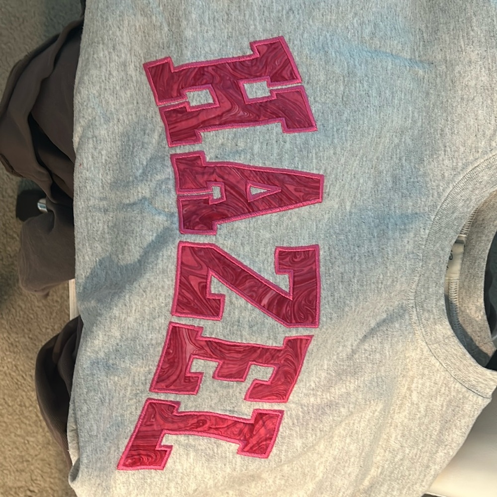 Grey Hazel sweatshirt with pink swirl letters. only worn a few times. Size xl